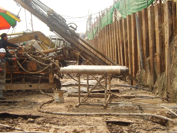 Khoan neo tường vây